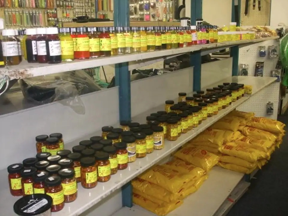Shelves of carp flavours and bags of groundbait